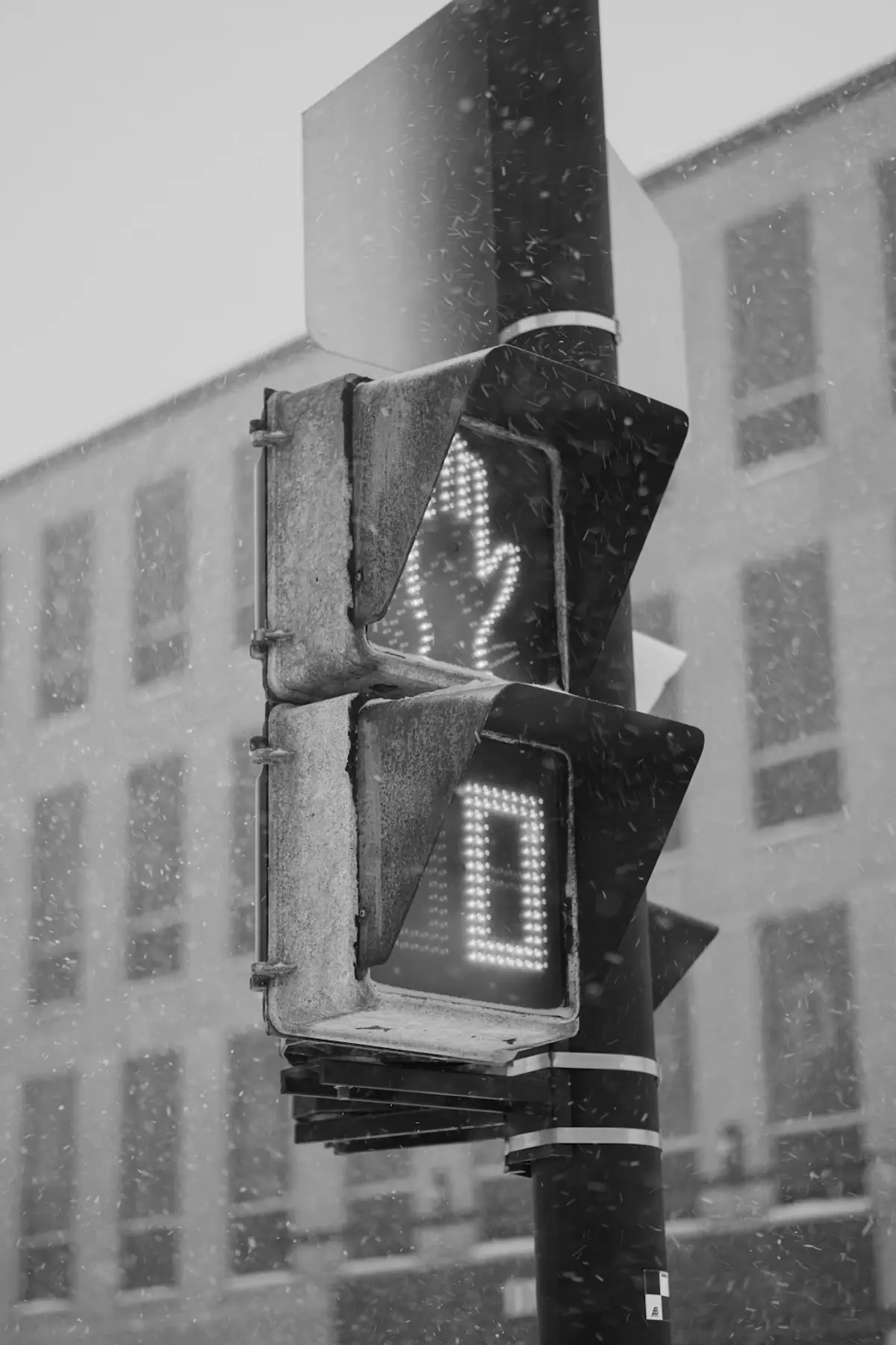A black and white photo of a traffic light
